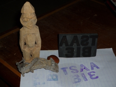Three of the buried items, with the stamp