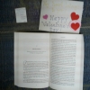 Back of photo, inside of book and card