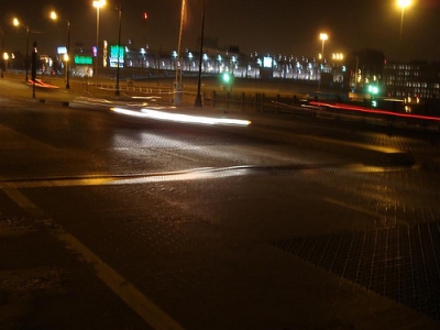 A street populated by ghosts of light!  I am kidding.  It is a camera trick.