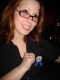 Kristin proudly displays her ribbon. We did not think we would make it this far without being tagged.
