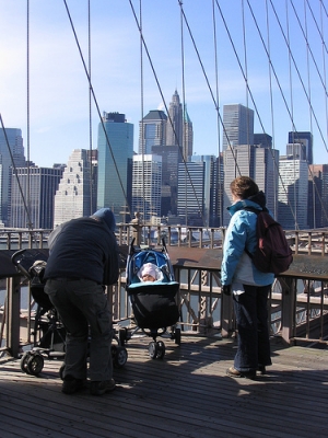 Proud parents photographing the baby on the bridge. Proud parents photographing the baby on the bridge.