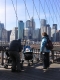 Proud parents photographing the baby on the bridge.