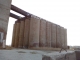 The smaller group of grain storage tubes. Probably about 150 feet tall.