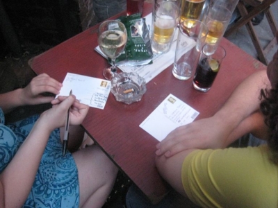 Happily completing a postcard