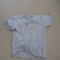 The T Shirt is laid out to meet its fate.