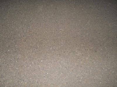 We crossed from asphalt onto this. Harder than soil still, but not as bumpy as asphalt.