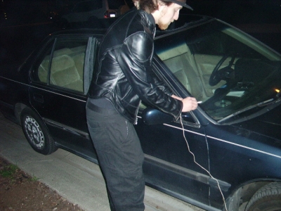 Wednesday ties a car to a tree...