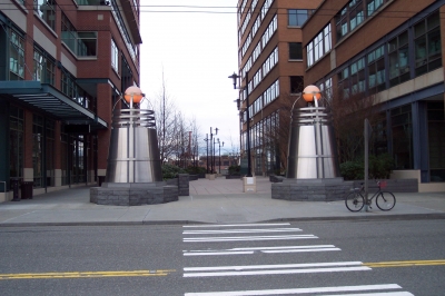 plaza between office buildings, guarded by daleks