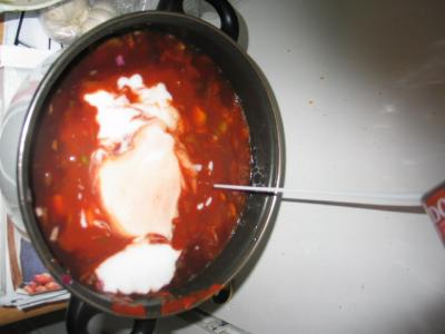 pouring in coconut milk the secret ingredient.JPG pouring in coconut milk the secret ingredient.JPG