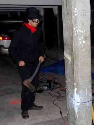 The man is holding an axe... beware.