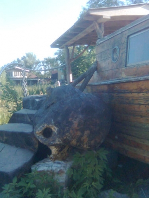 An old boat was beached outside.  