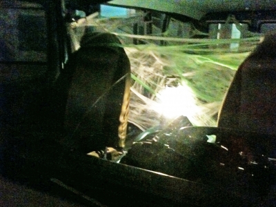 a van in an alley filled with cobwebs