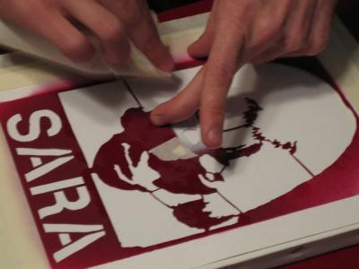 Holding the stencil down