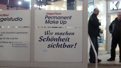 On the window front of a beauty salon. On the window front of a beauty salon.