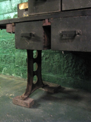 Front low, with blocking for legs to avoid basement water.