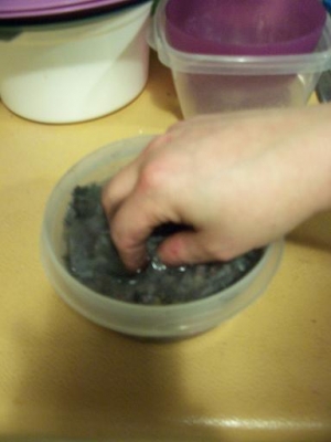 mushing up newspaper