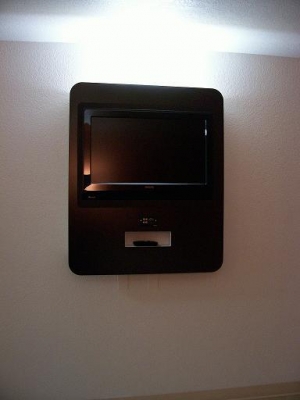TV opposite the bed