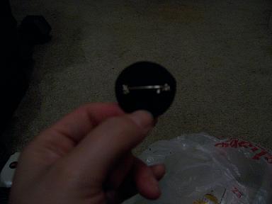 pin back goes through holes in felt circle pin back goes through holes in felt circle